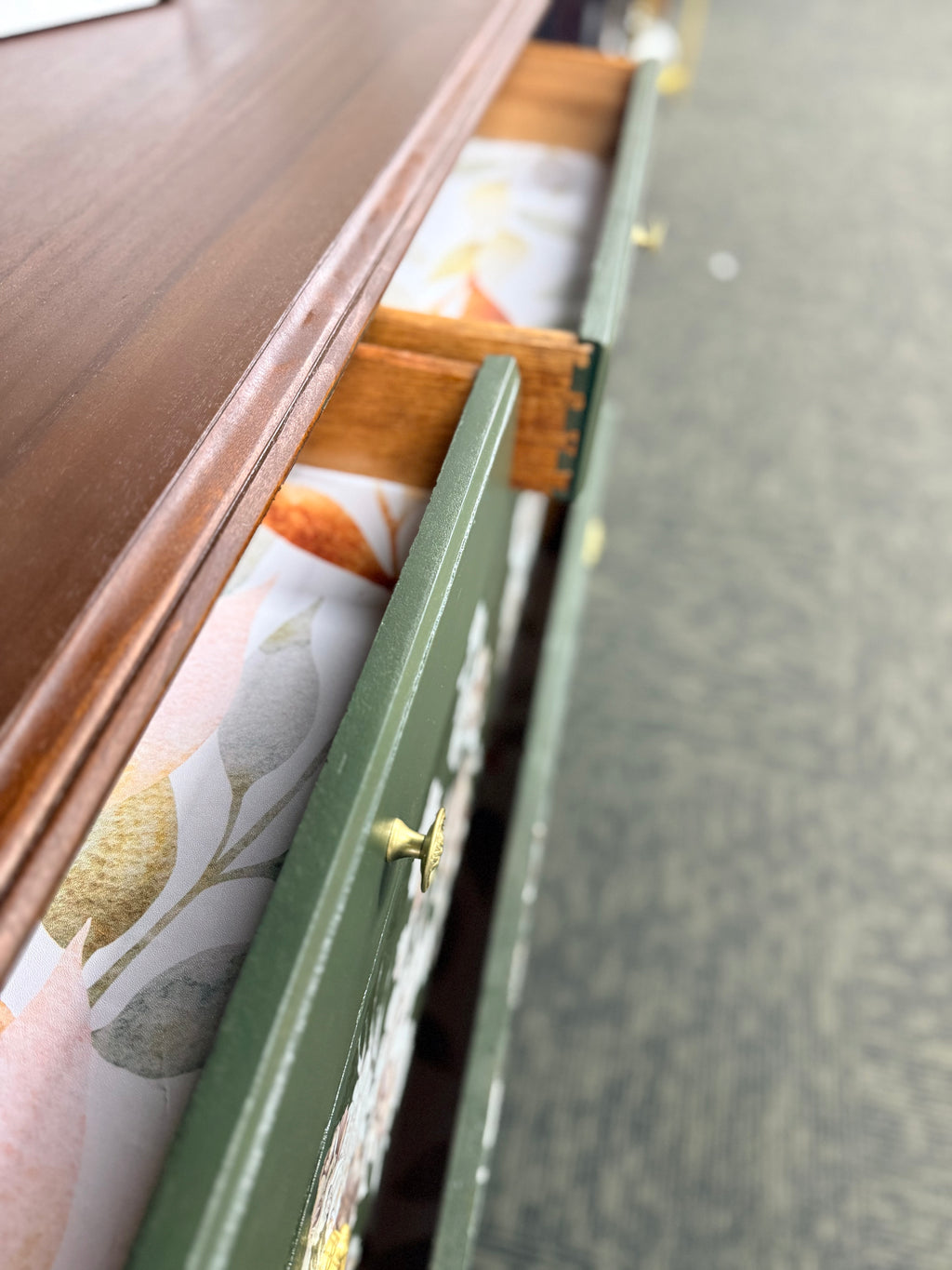 Dark Green Dresser with Floral Accents